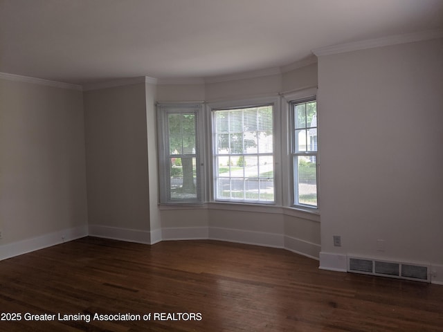 542 Riley St, Lansing, MI 48910 - spare room with wood finished floors and crown molding
