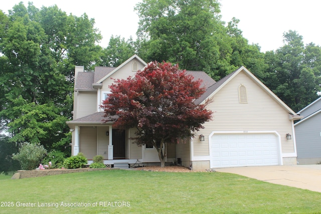 8522 Ember Glen Pass, Lansing, MI 48917 - obstructed view of property featuring concrete driveway, a front lawn, a porch, a garage, and a chimney