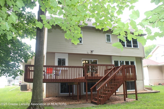 8522 Ember Glen Pass, Lansing, MI 48917 - rear view of house featuring a deck, a yard, and stairway