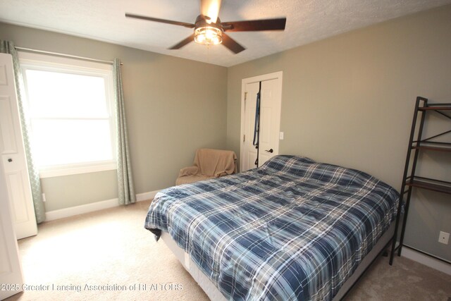 8522 Ember Glen Pass, Lansing, MI 48917 - bedroom with light carpet and a ceiling fan