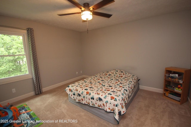 8522 Ember Glen Pass, Lansing, MI 48917 - carpeted bedroom with baseboards and a ceiling fan