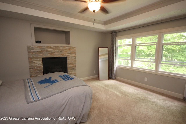 8522 Ember Glen Pass, Lansing, MI 48917 - bedroom featuring ornamental molding, light carpet, a raised ceiling, and a ceiling fan