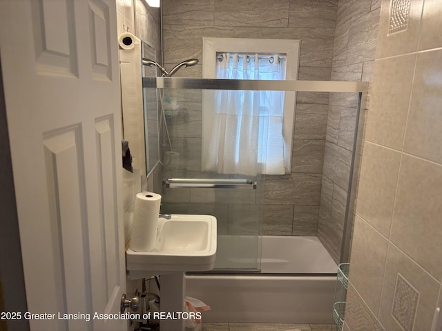 1311 W Saginaw St, East Lansing, MI 48823 - full bath with shower / bath combination with glass door and tile walls