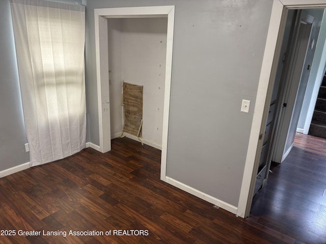 1311 W Saginaw St, East Lansing, MI 48823 - unfurnished bedroom with baseboards and wood finished floors