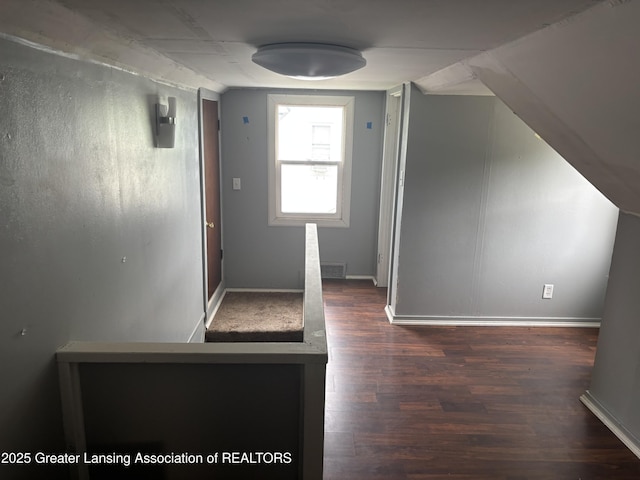 1311 W Saginaw St, East Lansing, MI 48823 - bonus room featuring wood finished floors and baseboards