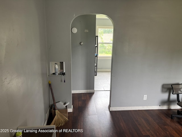 1311 W Saginaw St, East Lansing, MI 48823 - hall with arched walkways and wood finished floors