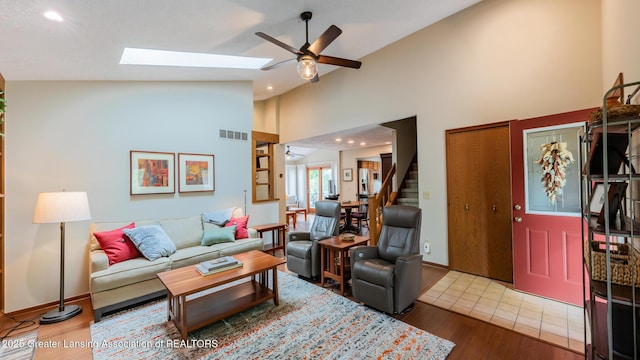 3522 Apple Valley Rd, Okemos, MI 48864 - living area with ceiling fan, stairway, high vaulted ceiling, wood finished floors, and recessed lighting