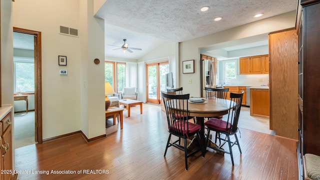 3522 Apple Valley Rd, Okemos, MI 48864 - dining area featuring a ceiling fan, wood finished floors, a textured ceiling, lofted ceiling, and recessed lighting