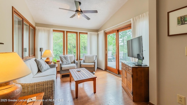 3522 Apple Valley Rd, Okemos, MI 48864 - living room featuring vaulted ceiling, ceiling fan, and light wood finished floors