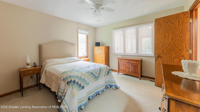 3522 Apple Valley Rd, Okemos, MI 48864 - bedroom with light colored carpet, a textured ceiling, and ceiling fan