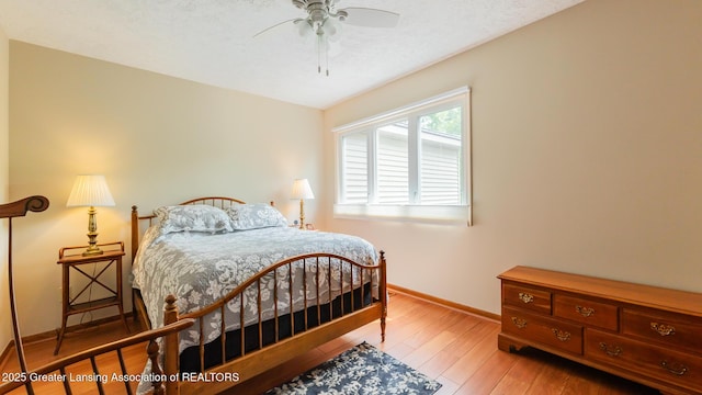 3522 Apple Valley Rd, Okemos, MI 48864 - bedroom with wood-type flooring and a ceiling fan