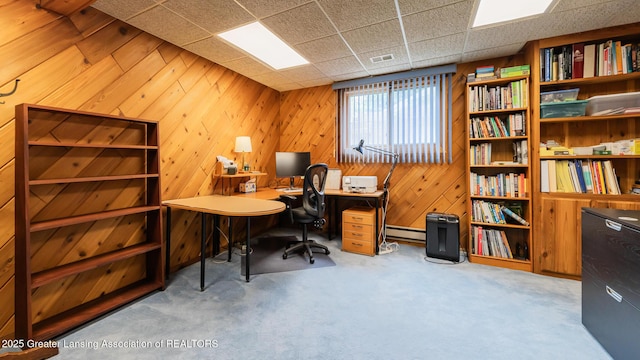 3522 Apple Valley Rd, Okemos, MI 48864 - carpeted home office featuring wood walls, a baseboard radiator, and a drop ceiling