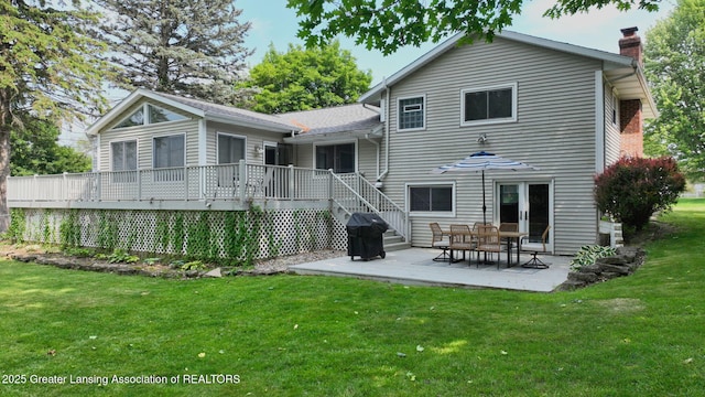 6916 Toboggan Ln, Lansing, MI 48917 - rear view of property with a chimney, a lawn, a patio, and a deck
