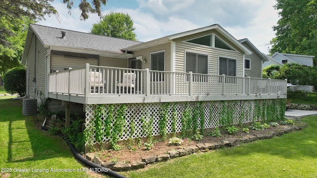 6916 Toboggan Ln, Lansing, MI 48917 - rear view of property featuring a wooden deck, a yard, and roof with shingles