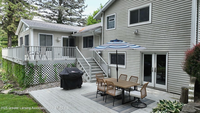 6916 Toboggan Ln, Lansing, MI 48917 - deck featuring grilling area, outdoor dining space, french doors, and stairs