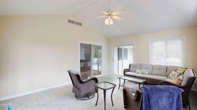 6916 Toboggan Ln, Lansing, MI 48917 - carpeted living room with ceiling fan and high vaulted ceiling