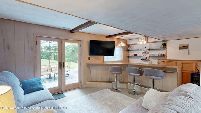 6916 Toboggan Ln, Lansing, MI 48917 - bar area with wooden walls, french doors, and beam ceiling