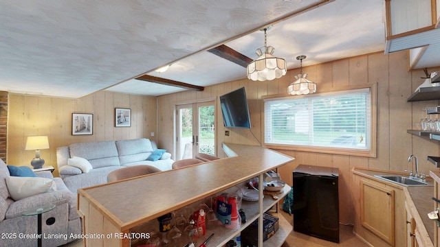 6916 Toboggan Ln, Lansing, MI 48917 - living room featuring wooden walls and french doors
