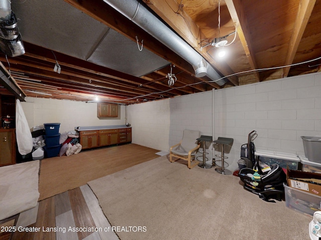 6916 Toboggan Ln, Lansing, MI 48917 - unfinished below grade area with wood finished floors