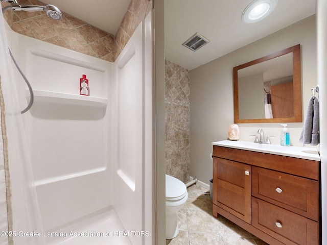 6916 Toboggan Ln, Lansing, MI 48917 - bathroom featuring vanity, a shower, and tile patterned flooring