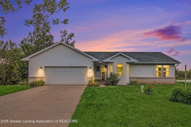 6093 Anchor Cv, Dimondale, MI 48821 - ranch-style house featuring brick siding, concrete driveway, a garage, and a yard