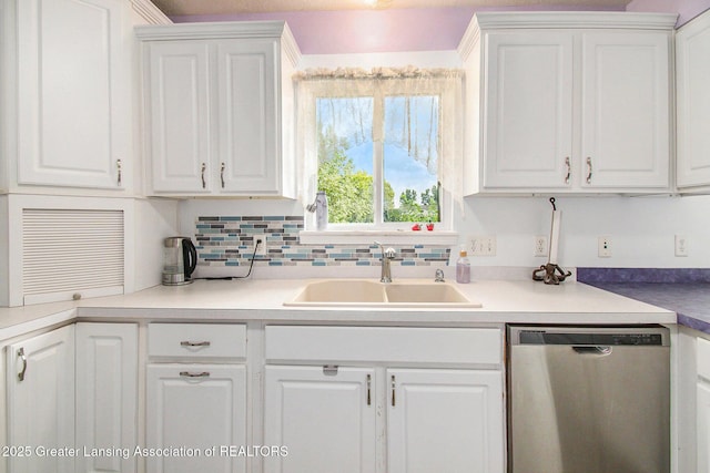 6093 Anchor Cv, Dimondale, MI 48821 - kitchen featuring dishwasher and white cabinetry