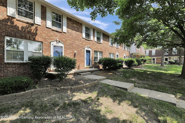 6213 Beechfield Dr, Lansing, MI 48911 - colonial inspired home featuring brick siding and a front yard