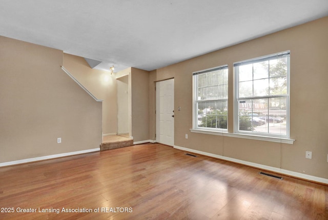 6213 Beechfield Dr, Lansing, MI 48911 - foyer entrance with wood finished floors and healthy amount of natural light
