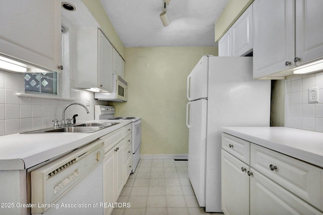 6213 Beechfield Dr, Lansing, MI 48911 - kitchen with white appliances, tasteful backsplash, and white cabinetry