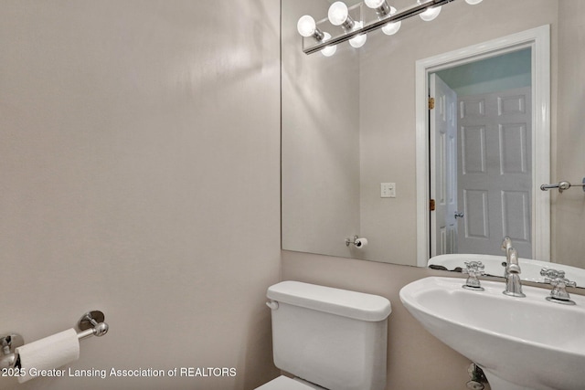 6213 Beechfield Dr, Lansing, MI 48911 - bathroom with toilet and a sink