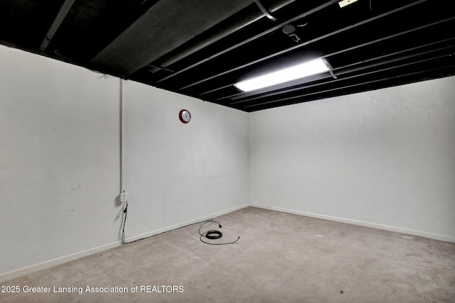6213 Beechfield Dr, Lansing, MI 48911 - finished below grade area featuring carpet floors and baseboards