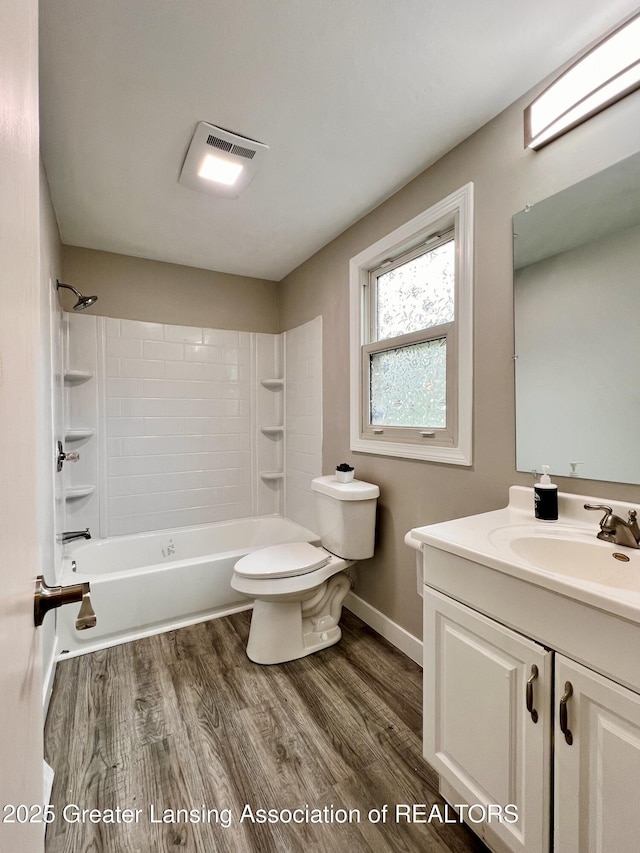 5401 Catalpa Dr, Lansing, MI 48911 - bathroom featuring vanity, bathing tub / shower combination, and wood finished floors
