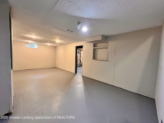 5401 Catalpa Dr, Lansing, MI 48911 - basement with a textured ceiling