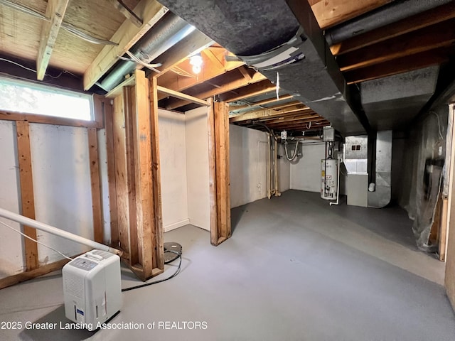 5401 Catalpa Dr, Lansing, MI 48911 - below grade area featuring heating unit and water heater