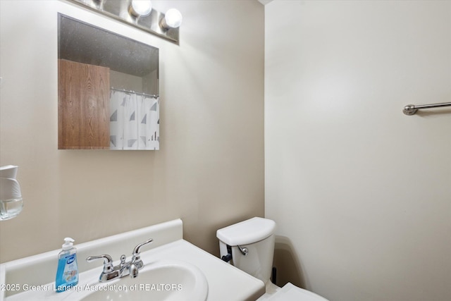1457 E Pond Dr Unit 21, Okemos, MI 48864 - bathroom featuring toilet and vanity