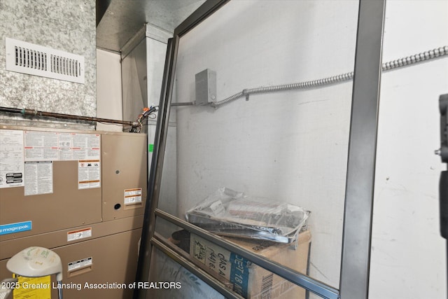 1457 E Pond Dr Unit 21, Okemos, MI 48864 - utility room featuring heating unit