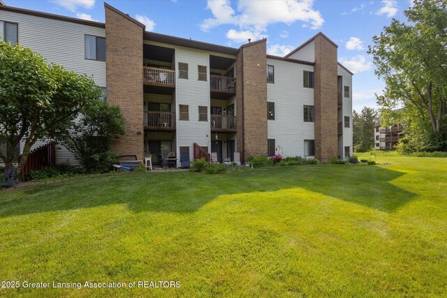 1457 E Pond Dr Unit 21, Okemos, MI 48864 - view of apartment building / complex