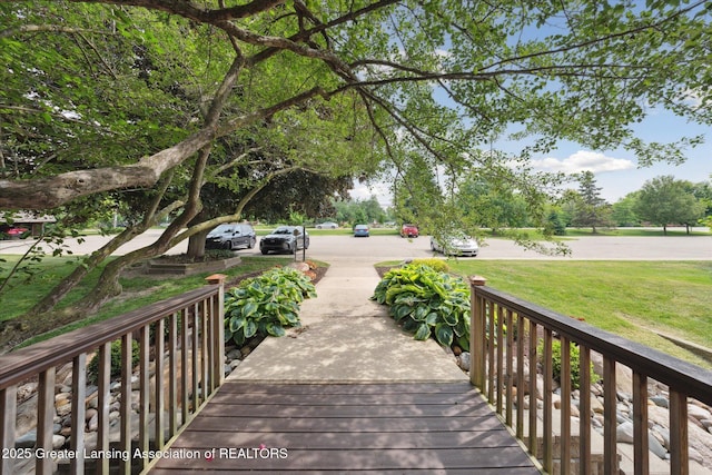 2926 Mount Hope Rd Unit 105, Okemos, MI 48864 - deck featuring a lawn