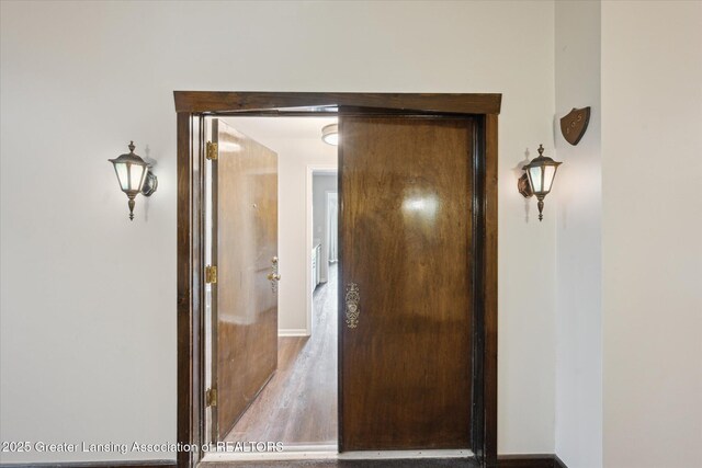 2926 Mount Hope Rd Unit 105, Okemos, MI 48864 - hall with wood finished floors