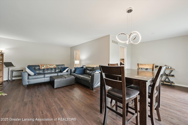 2926 Mount Hope Rd Unit 105, Okemos, MI 48864 - dining room with dark wood finished floors and a chandelier