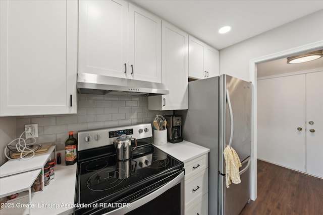 2926 Mount Hope Rd Unit 105, Okemos, MI 48864 - kitchen featuring stainless steel appliances, under cabinet range hood, light countertops, white cabinetry, and decorative backsplash