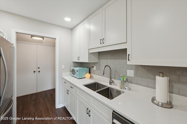 2926 Mount Hope Rd Unit 105, Okemos, MI 48864 - kitchen with freestanding refrigerator, dark wood-type flooring, white cabinetry, light countertops, and recessed lighting
