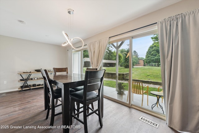 2926 Mount Hope Rd Unit 105, Okemos, MI 48864 - dining space with wood finished floors