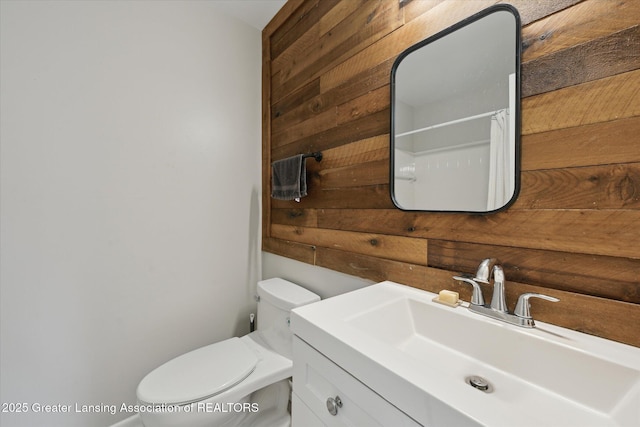 2926 Mount Hope Rd Unit 105, Okemos, MI 48864 - full bathroom with wooden walls, vanity, and a shower with curtain