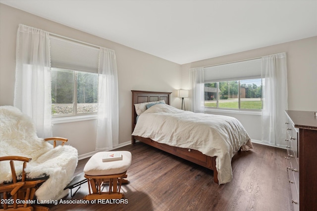 2926 Mount Hope Rd Unit 105, Okemos, MI 48864 - bedroom featuring dark wood finished floors and baseboards