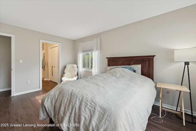 2926 Mount Hope Rd Unit 105, Okemos, MI 48864 - bedroom with dark wood-type flooring and baseboards
