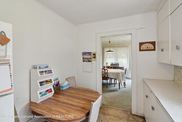 1213 N Woodworth Rd, Jackson, MI 49202 - dining area featuring ornamental molding and light carpet