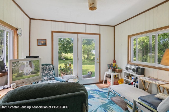 1213 N Woodworth Rd, Jackson, MI 49202 - living area with crown molding, plenty of natural light, and wood walls