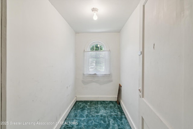 1213 N Woodworth Rd, Jackson, MI 49202 - unfurnished room with dark carpet and baseboards