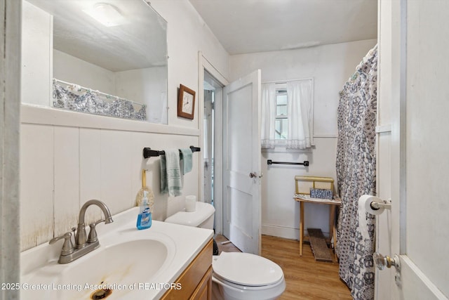 1213 N Woodworth Rd, Jackson, MI 49202 - full bath with vanity, wood finished floors, and curtained shower